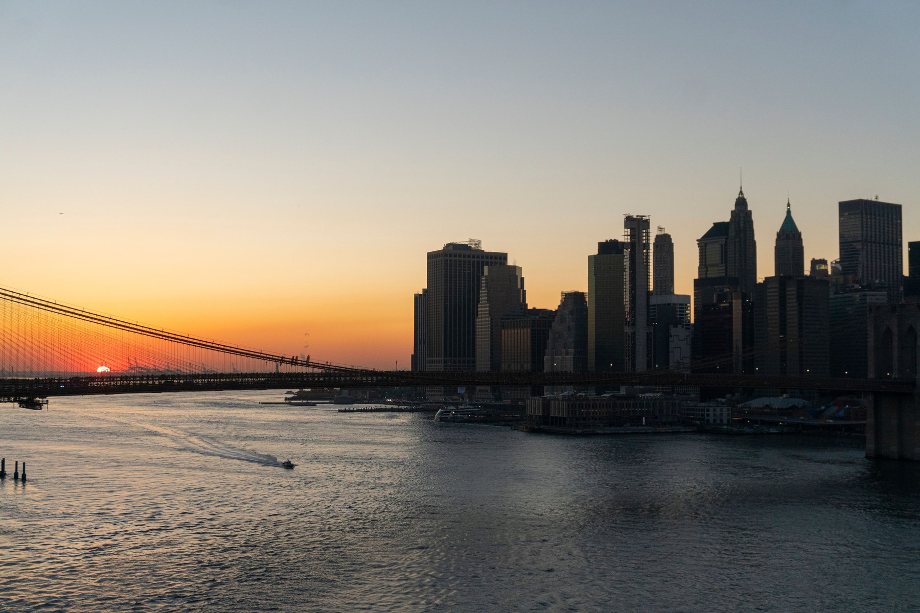 Brooklyn Bridge and the Lower Manhattan skyline at sunset